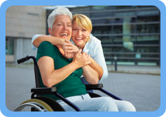 elder in a wheelchair with caregiver